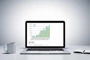 notebook, cup and diary on table in office